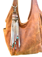 Load image into Gallery viewer, Handmade Natural Hair on Hide Leather Clip Tassel
