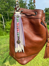 Load image into Gallery viewer, Handmade Leather Clip Tassel, Bone and Purple Sparkle
