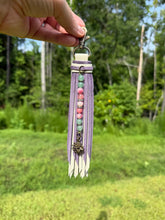 Load image into Gallery viewer, Handmade Leather Clip Tassel, Bone and Purple Sparkle
